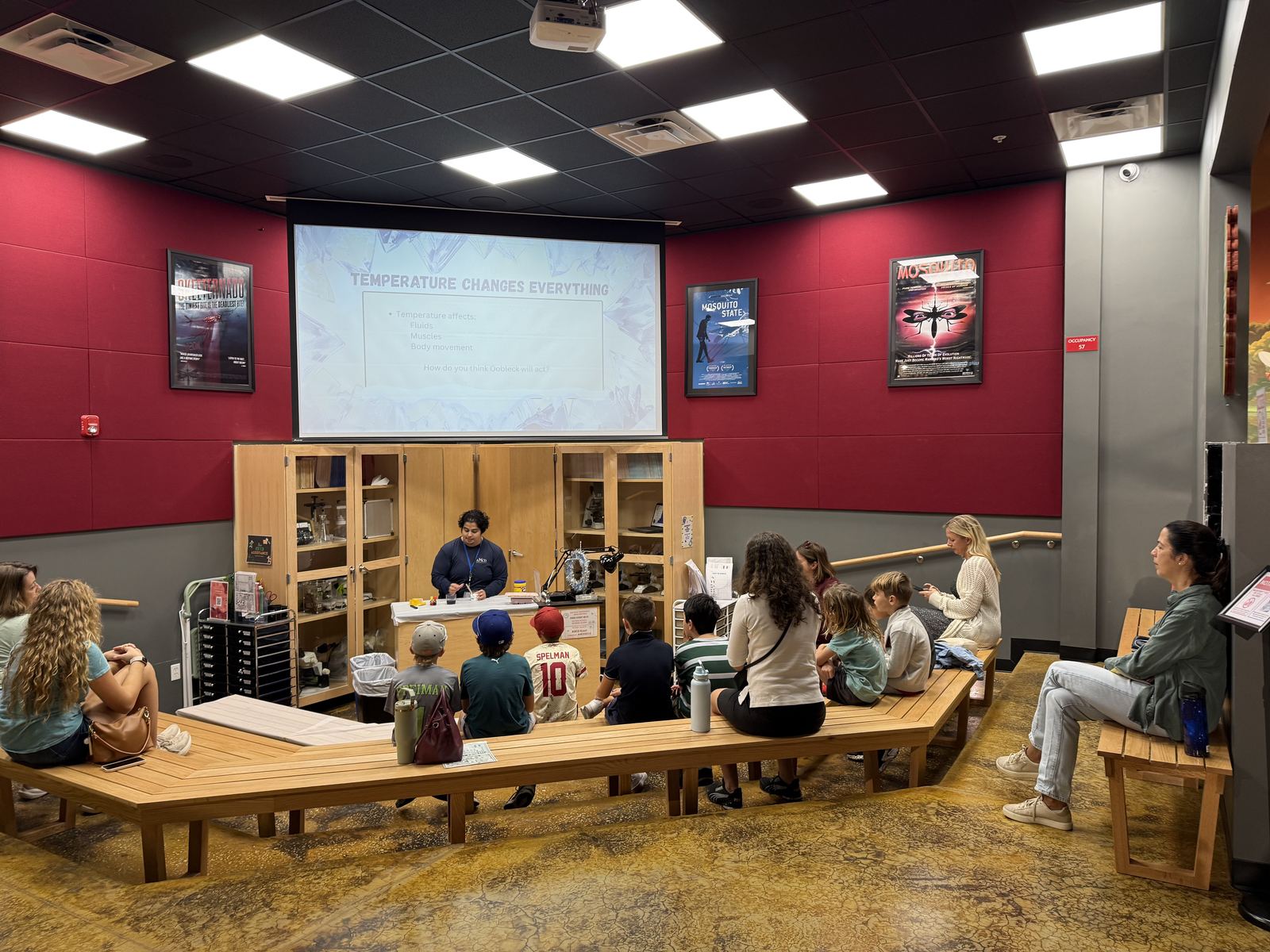 Homeschool students and families attending a hands-on science presentation at a Florida education center